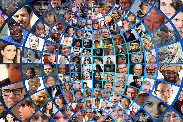 Montage of diverse faces in the shape of the world